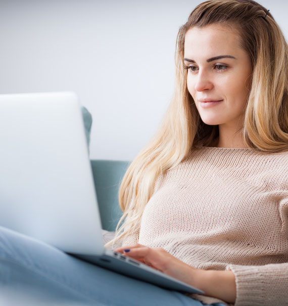 woman looking at laptop